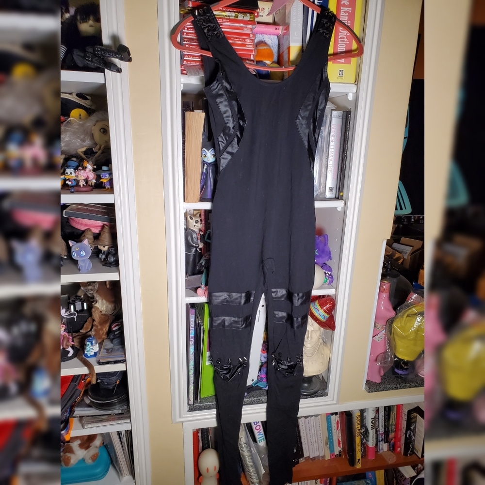 Black sleeveless jumpsuit with spikey stud details
